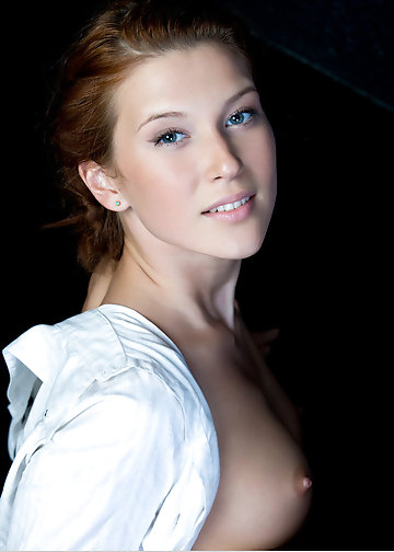 Skinny belle dressed only in white shirt poses in front of cam in various ways