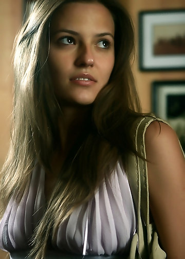 Sensual girl is eager to get rid of her top and shorts