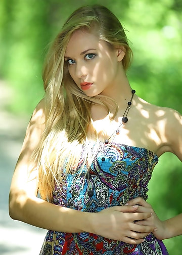 Colorful dress doesn't stop a chick from revealing her tits