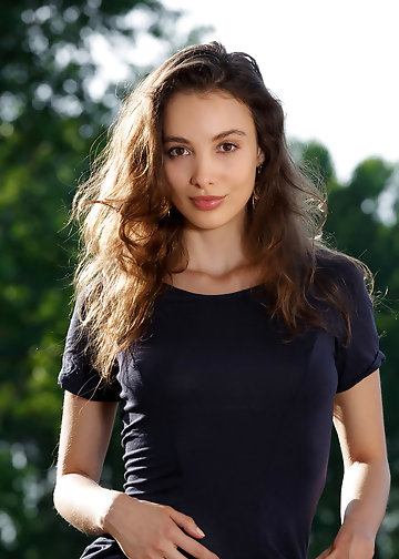 Good-looking brunette not shy to strip naked on sunny balcony