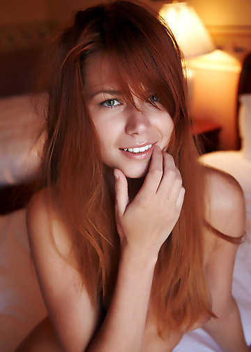 Redheaded hottie spreads her legs and shows her sensitive spots