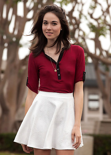 Shy girl doesn't undress still she flashes striped panties in the park