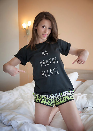 Brunette girl takes her shorts off to show her sexy ass