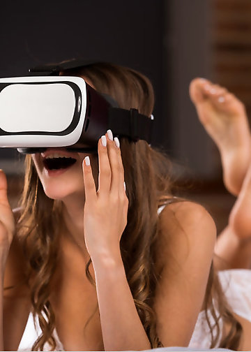 Pretty naked girl with untanned boobs lies on the purple bed