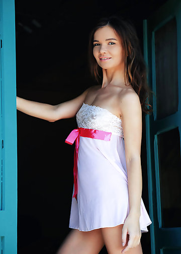 Fragile babe with small tits flashes bald pussy on the couch