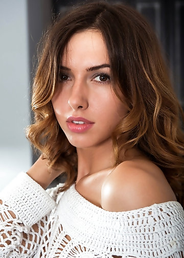 Teen with big smile and wavy hair makes white sweater underscore her titties