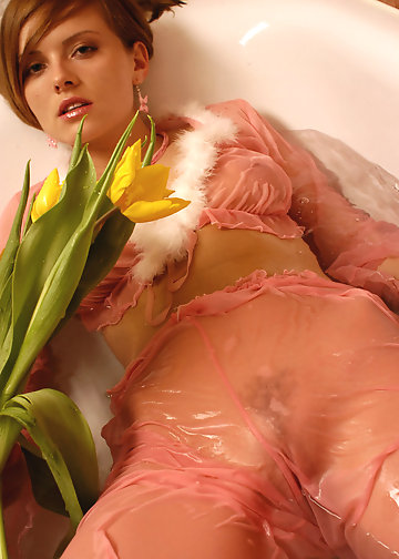 Charmer loves taking a bath with beautiful flowers in the water