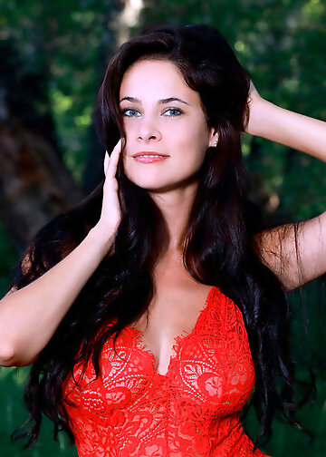 Dark-haired girl shows mind-boggling natural boobs in forest