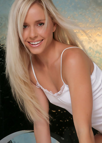 Small-tittied blonde with a cute face is glad to pose in the fresh air