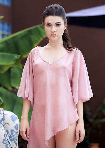 Blue-eyed chick gets rid of her pink dress when she is outdoors