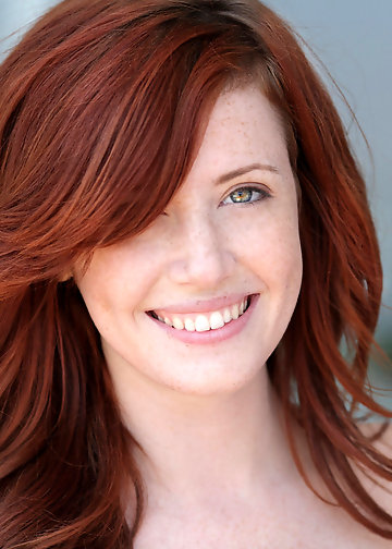 Redheaded naked girl goes outdoors and fully undresses herself