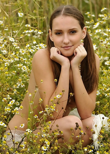 Skinny brunette goes outdoors to reveal her round ass