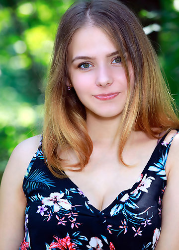 Cutie takes a walk in the forest when she decides to get naked