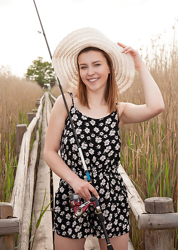 Eye-catching Latvian nude female model happily poses in the fresh air