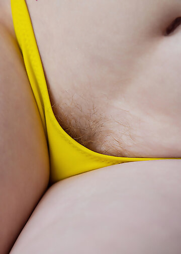 Redhead young woman with hairy armpits and pubis