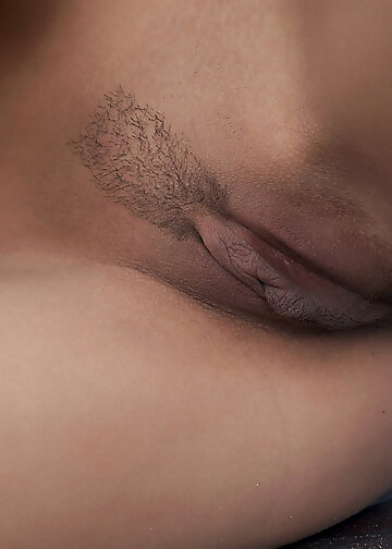 Naked brunette with beautiful boobs caresses her tender body on the pier