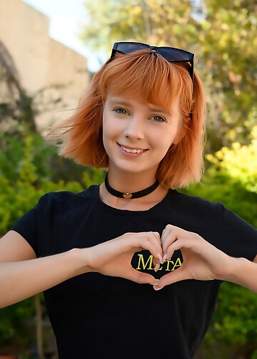 Marta Gromova is a sexy petite redheaded woman